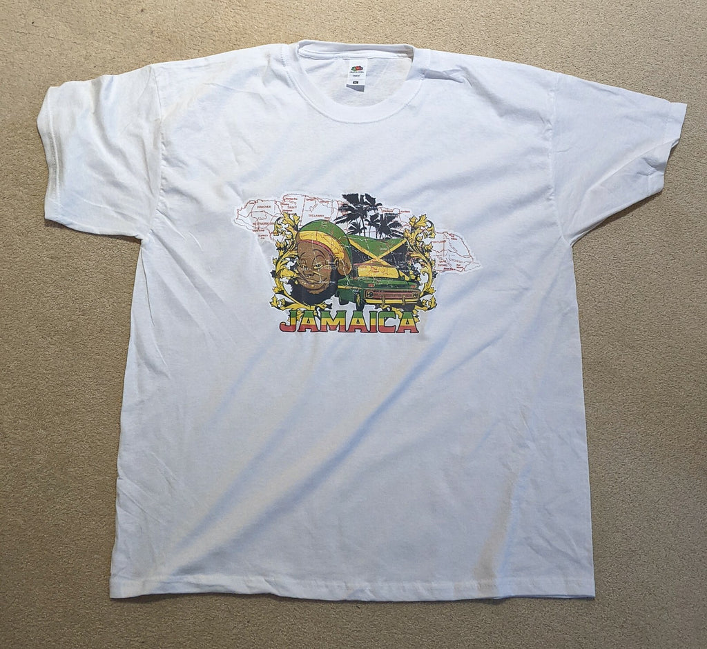 White T-shirt printed with the map of Jamaica, a Rasta man, the flag and palm trees