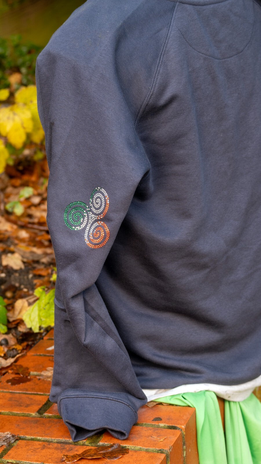 Navy jumper with a sparkling Triskelion Celtic knot in Irish tricolour rhinestones – view 3